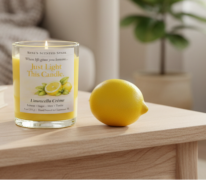 Limoncello Crème citrus coconut wax candle on a wooden table next to a fresh lemon in a cozy living room