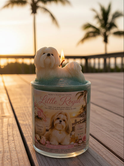Candle in a tin labeled 'Little Royal' with a dog design on a wooden surface at sunset.