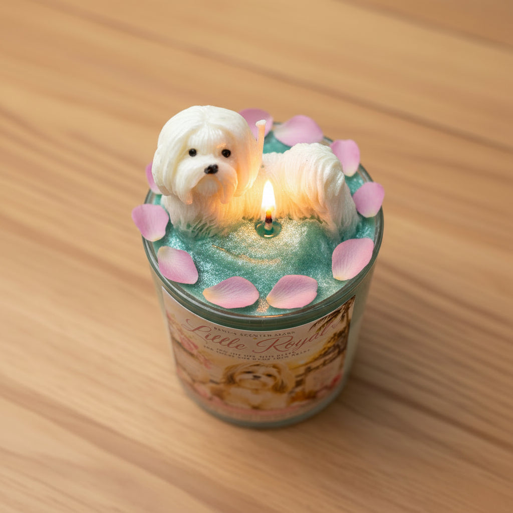 Candle with a dog figurine and pink petals on a wooden surface