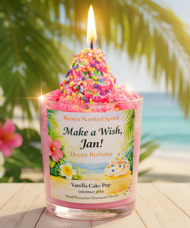 Candle with colorful sprinkles labeled 'Make a Wish, Jan!' in a tropical setting