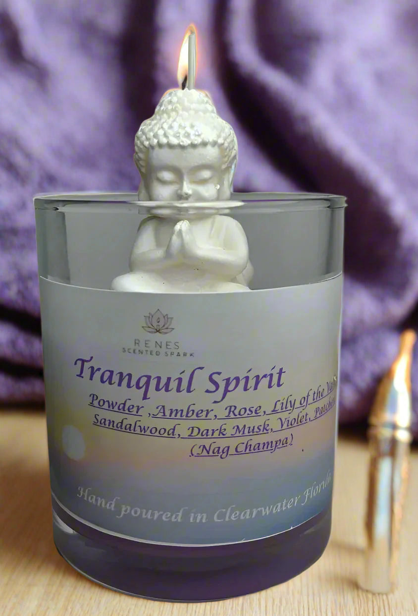 Tranquil Spirit candle glowing beside a yoga mat, crystals, and incense, creating a serene meditation space