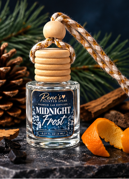 Midnight Frost car freshener by Rene’s Scented Spark styled with pine branches, pinecones, orange peel, and warm wood accents.