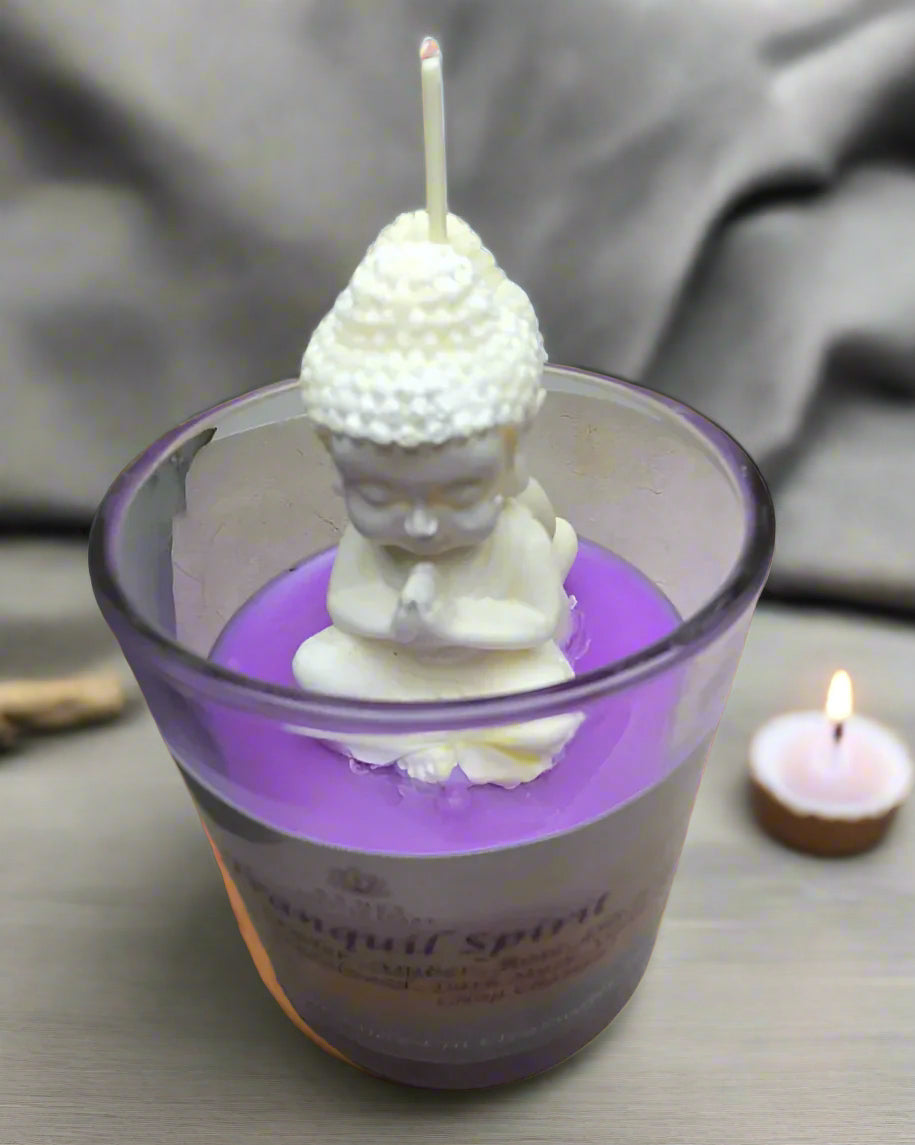 Tranquil Spirit candle glowing beside a yoga mat, crystals, and incense, creating a serene meditation space
