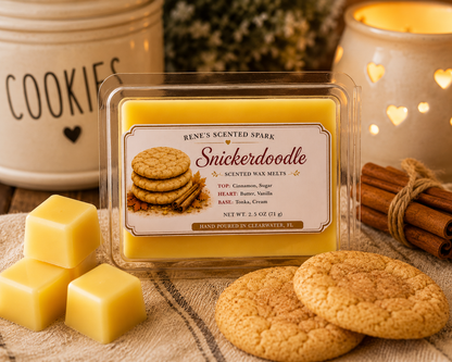 Snickerdoodle scented wax melts by Renes Scented Spark with golden wax cubes, cinnamon sugar cookies, cinnamon sticks and a glowing wax warmer in a cozy bakery-inspired setting.