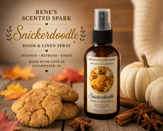 Snickerdoodle room and linen spray by Rene’s Scented Spark in an amber spray bottle, styled with snickerdoodle cookies, cinnamon sticks, star anise, white pumpkins, and colorful autumn leaves.