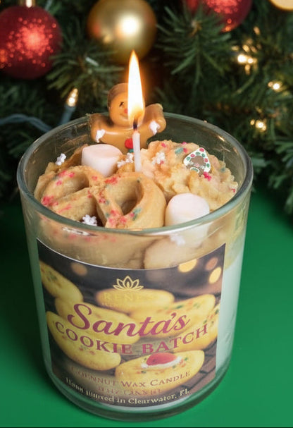 Candle in a jar labeled 'Santa's Cookie Batch' with a Christmas tree in the background