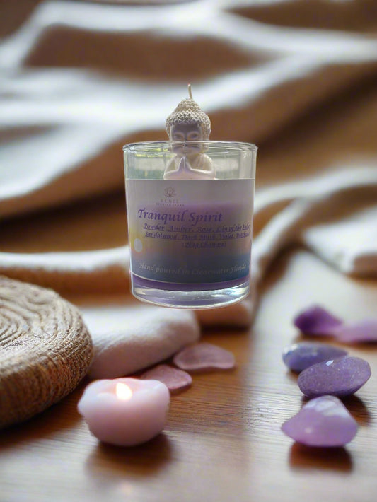 Tranquil Spirit candle glowing beside a yoga mat, crystals, and incense, creating a serene meditation space