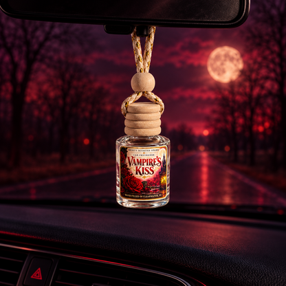 Vampire's Kiss car freshener hanging from a rearview mirror with a full moon over a dark road at night
