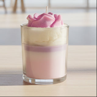 Lavender vanilla soy candle with pink rose wax top, minimalist spa setting with bamboo and soft lighting