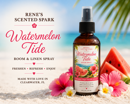 A bottle of Rene's Scented Spark Watermelon Tide Room and Linen Spray stands on a sandy beach with tropical flowers, watermelon slices, and a blurred ocean background. 