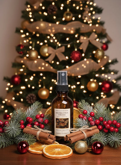 Bottle of winter citrus wreath spray with Christmas decorations in the background