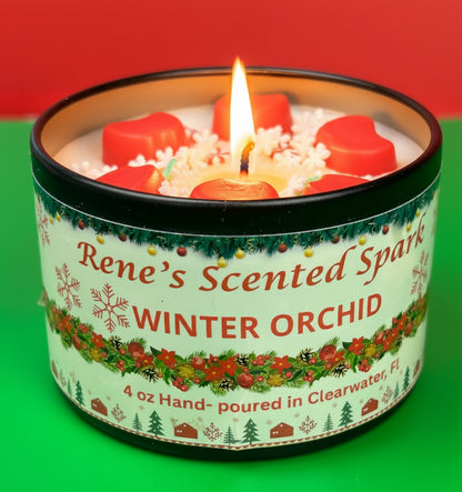 4 oz Winter Orchid candle tin with red wax stars and peppermint decorations, hand-poured by Rene’s Scented Spark in Clearwater, FL.