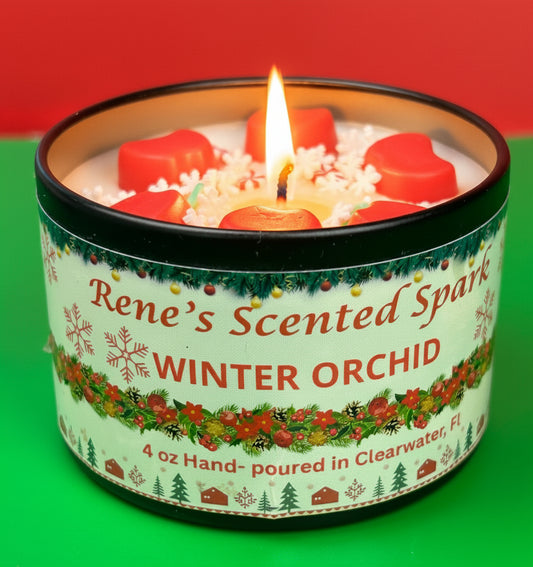 4 oz Winter Orchid candle tin with red wax stars and peppermint decorations, hand-poured by Rene’s Scented Spark in Clearwater, FL.