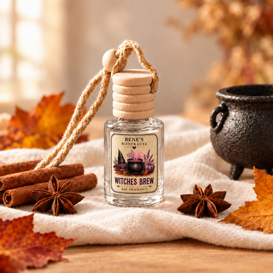 Witches Brew hanging car freshener by Renes Scented Spark styled with purple satin, a glowing lantern, herbs and a decorative pumpkin for a mystical fall setting.