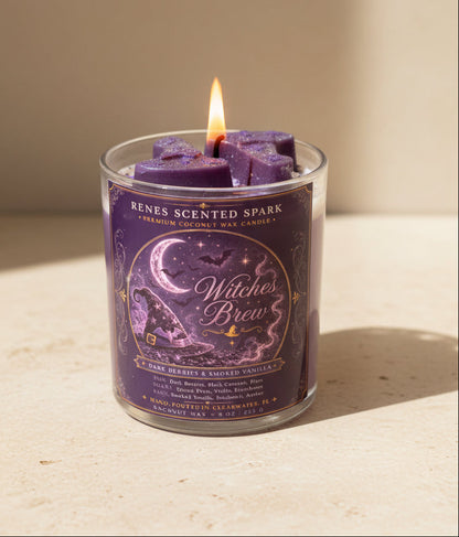 Witches Brew Halloween coconut wax candle burning in warm natural light, featuring purple witch hat wax toppers and a detailed witch-inspired label.