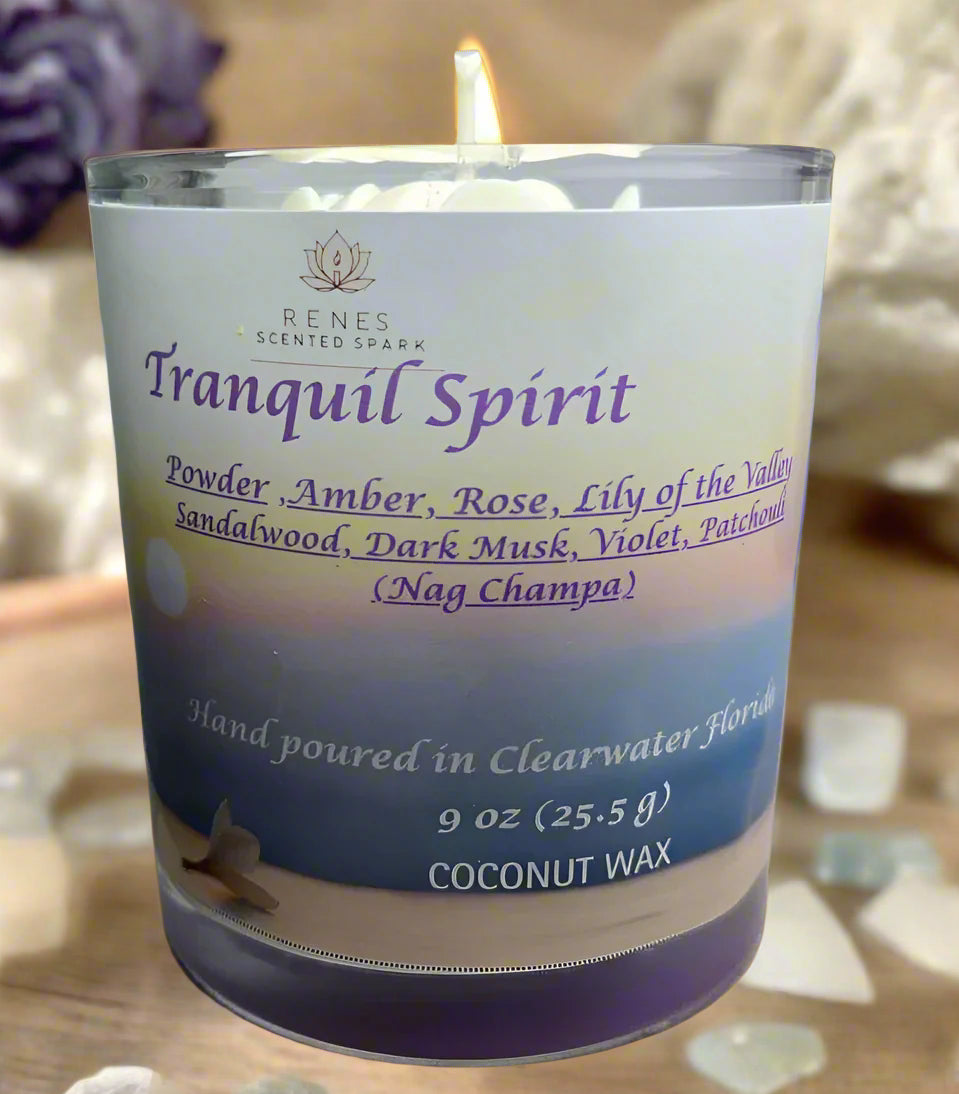Tranquil Spirit candle glowing beside a yoga mat, crystals, and incense, creating a serene meditation space